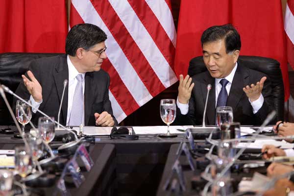 China's Vice-Premier Wang Yang (right) talks with US Treasury Secretary Jacob Lew at the start of the China-US Strategic and Economic Dialogue at the Treasury Department in Washington on Wednesday. [Photo/China Daily]