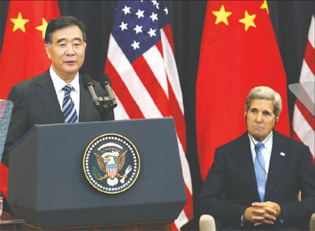 US Secretary of State John Kerry listens as China&apos;s Vice-Premier Wang Yang delivers his opening remarks at the 5th annual China-US Strategic and Economic Dialogue in Washington on July 10, 2013. [Sun Chenbei / China Daily]