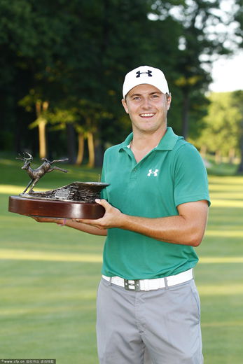  Jordan Spieth holds the trophy after winning a three way five hole sudden death playoff after the final round of the John Deere Classic held at TPC Deere Run on July 14, 2013 in Silvis, Illinois.