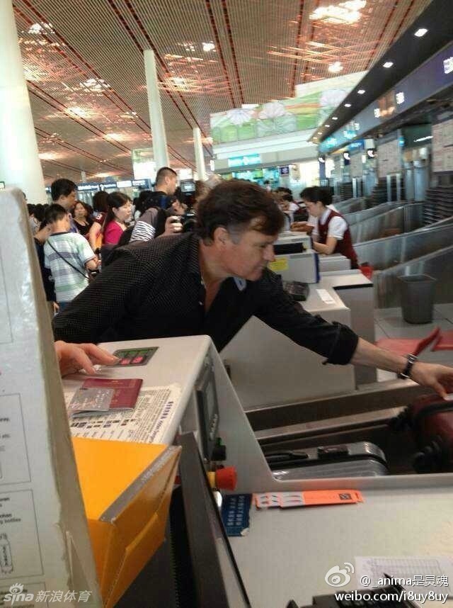 Former head coach of China's national soccer team José Antonio Camacho is seen at the Beijing Airport on July 16, 2013.