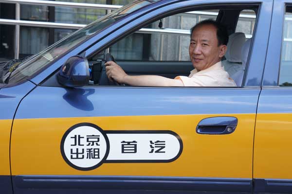 Beijing's 'savviest phone-booking' taxi driver Wang Chunsheng uses five different taxi apps to find customers. His cab provides free WiFi and USB ports for passengers to charge their phones. [China Daily]
