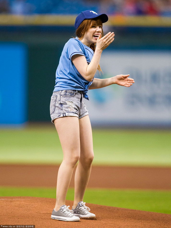 Pop star Carly Rae Jepsen throws in the first pitch before the Tampa Bay Rays game against the Houston Astros at Tropicana Field on July 14, 2013.