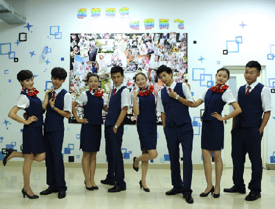 Students of flight attendant major in Inner Mongolia Normal University pose for photo on July 8, 2013. [Photo/Xinhua]