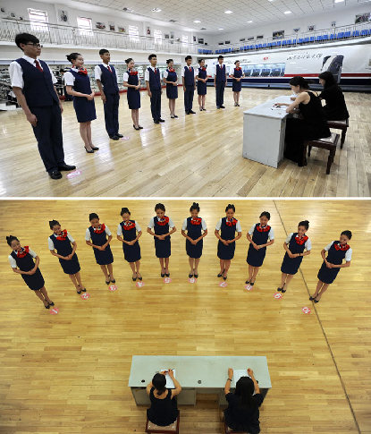 Teachers hold mock interview for the students of flight attendant major in Inner Mongolia Normal University, July, 8, 2013. [Photo/Xinhua]