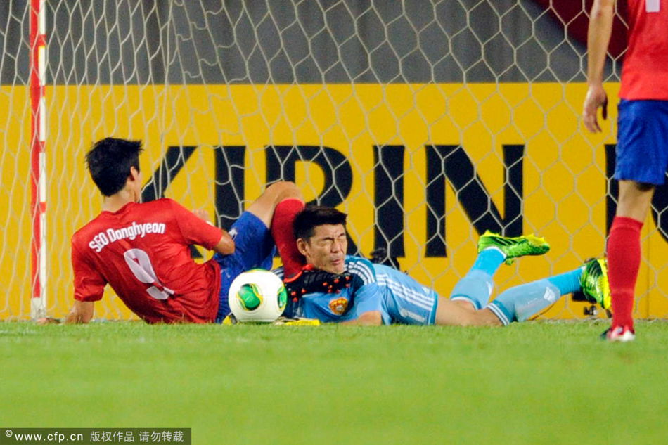 Zeng Cheng of China was kicked in the face by Seo Dong-hyeon of South Korea in the draw at the East Asian Cup in the Hwaseong Stadium on Wednesday.