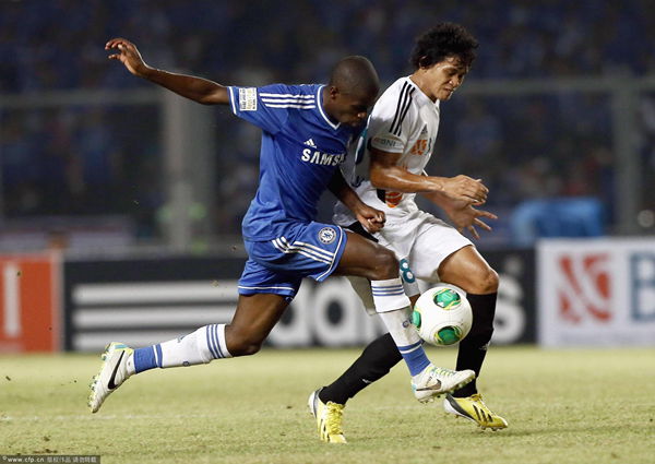 Ramires of Chelsea tackles Ferdinand Sinaga of Indonesia Allstars during the match between Chelsea and Indonesia All Stars at Gelora Bung Karno Stadium on July 25, 2013 in Jakarta, Indonesia.