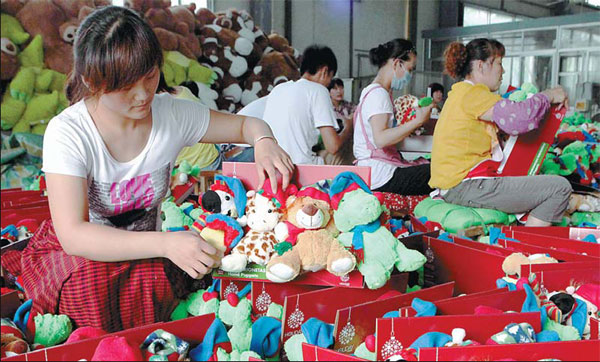 Workers make toys for export to Europe in Ganyu, Jiangsu province. China's export value in the first quarter accounted for 11.3 percent of all global trade, according to the World Trade Organization. 