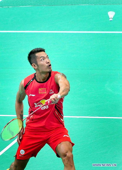 Lin Dan of China returns a shot during the men's singles 1st round match against Sattawat Pongnairat of the United States at the 2013 BWF World Championships on Aug. 5, 2013.