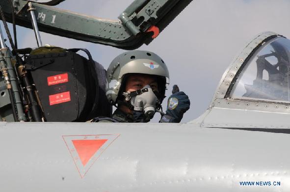 Pilot on a JH-7A fighter-bomber get prepared to take off during the Peace Mission-2013 China-Russia joint military drill in Chelyabinsk, Russia, Aug. 6, 2013. Five Chinese JH-7A fighter-bombers carried out their first reconnaissance mission in China-Russia joint military drills here Tuesday. [Photo/Xinhua] 