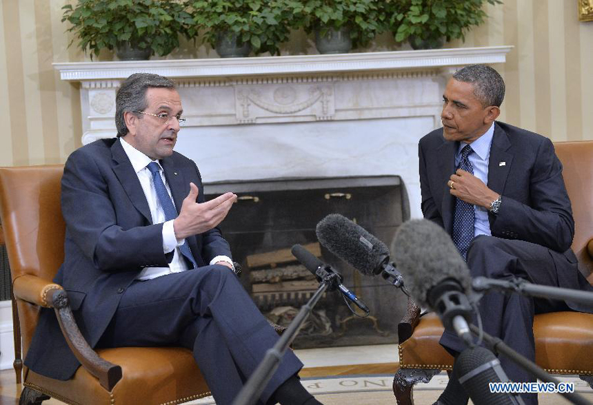 U.S. President Barack Obama (R) and visiting Greek Prime Minister Antonis Samaras speak to the media after their meeting in the Oval Office of the White House in Washington D.C., capital of the United States, Aug. 8, 2013. 