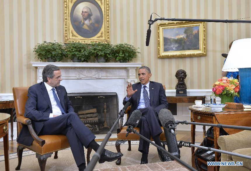 U.S. President Barack Obama (R) and visiting Greek Prime Minister Antonis Samaras speak to the media after their meeting in the Oval Office of the White House in Washington D.C., capital of the United States, Aug. 8, 2013.