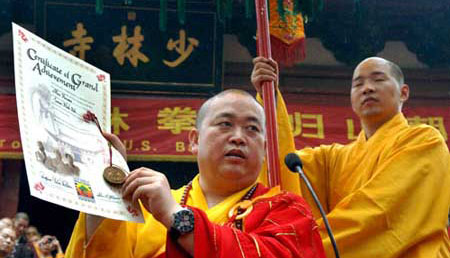 Abbot Shi Yongxin readout a martial art study certificate for an American student