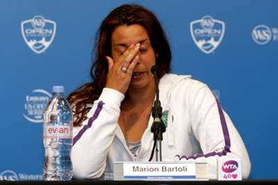  A tearful Bartoli announces her retirement from professional tennis.