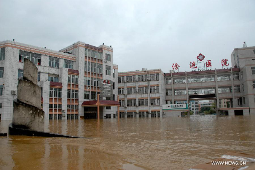 A local hospital is flooded in Hanguang Town of Yingde City, south China&apos;s Guangdong Province, Aug. 18, 2013. 