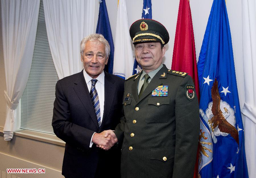 Chinese State Councilor and Defense Minister Chang Wanquan (R) shakes hands with U.S. Secretary of Defense Chuck Hagel during their meeting in the Pentagon in Washington D.C. , the United States, on Aug. 19, 2013. 