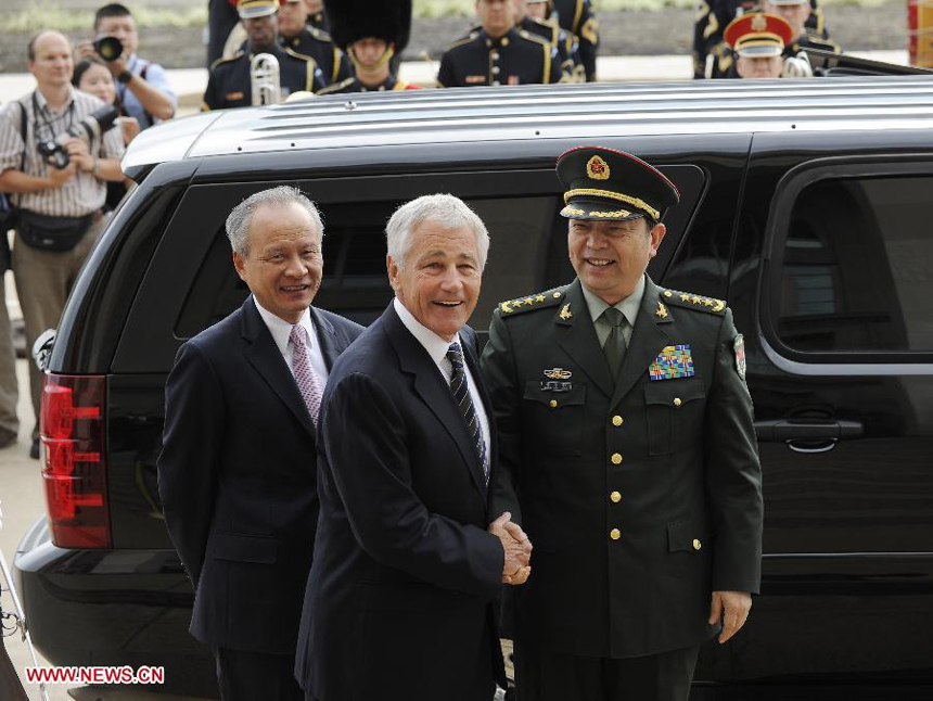 Chinese State Councilor and Defense Minister Chang Wanquan (R) is welcomed by U.S. Secretary of Defense Chuck Hagel during their meeting in the Pentagon in Washington D.C. , the United States, on Aug. 19, 2013.