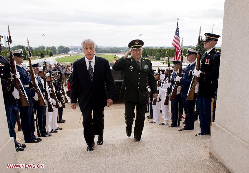 Chinese State Councilor and Defense Minister Chang Wanquan (R, Front) is welcomed by U.S. Secretary of Defense Chuck Hagel during their meeting in the Pentagon in Washington D.C. , the United States, on Aug. 19, 2013.