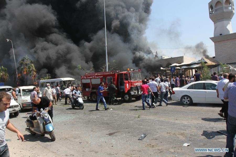 Smoke rises from the blast site in Tripoli, Lebanon, Aug. 23, 2013. At least 27 people were killed and 358 others injured on Friday when two powerful explosions rocked Lebanon's northern port city of Tripoli, the country's caretaker Health Minister Ali Hassan Khalil told reporters. [OmarXinhua]