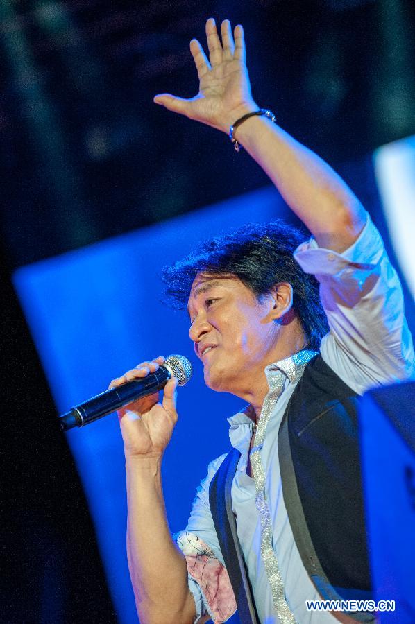 Singer Emil Wakin Chau performs during the Fun Music Festival in Fangshan District, Beijing, China, Aug. 23, 2013. The three-day music event kicked off here Friday, featuring a strong line-up of pop bands. [Zhang Yu/Xinhua]