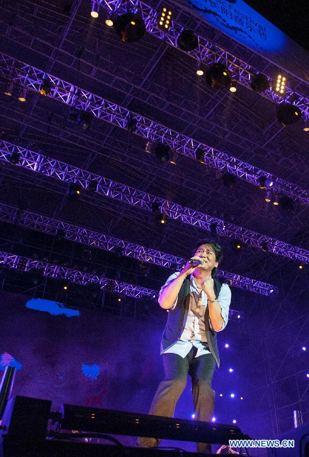 Singer Emil Wakin Chau performs during the Fun Music Festival in Fangshan District, Beijing, China, Aug. 23, 2013. The three-day music event kicked off here Friday, featuring a strong line-up of pop bands. [Zhang Yu/Xinhua]