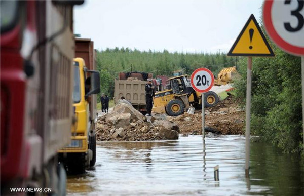 Floods cut off roads in NE China's county