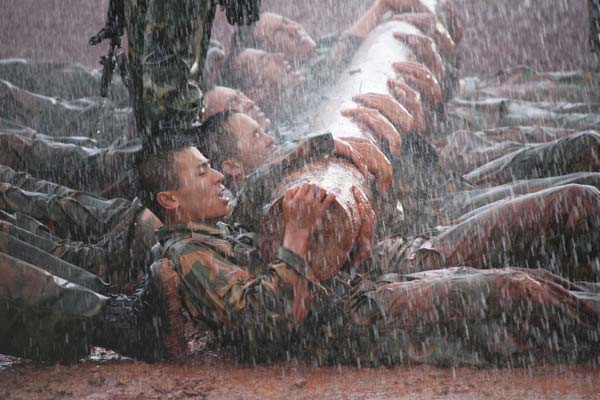Soldiers from China and India take part in the 'Hand in Hand' joint military drill in 2007, in Kunming, Yunnan province. The drill was the first joint anti-terrorism exercise for the two armies since 1962, when the two Asian neighbors had a brief border conflict. The two countries held another 'Hand in Hand' drill a year later. [Li Gang / Xinhua ]