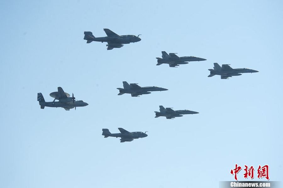 In a BBC interview, U.S. Defence Secretary Chuck Hagel said the U.S. forces stands ready to strike Syria if President Obama gives order. Photo taken on Aug. 15 shows the aircrafts from a carrier air wing. [Chinanews.com]