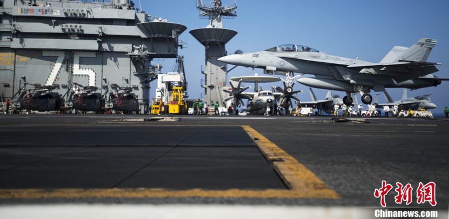 In a BBC interview, U.S. Defence Secretary Chuck Hagel said the U.S. forces stands ready to strike Syria if President Obama gives order. Photo taken on Aug. 15 shows the F/A-18F super hornet on an aircraft carrier. [Chinanews.com]