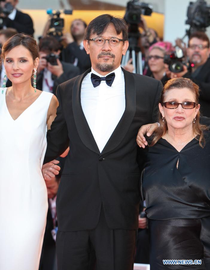 Member of the international Jury of Venezia 70 Jiang Wen (C) poses at the opening ceremony red carpet of the Venice Film Festival on the Lido island of Venice , Italy, Aug. 28, 2013. [Yan Ting/Xinhua]