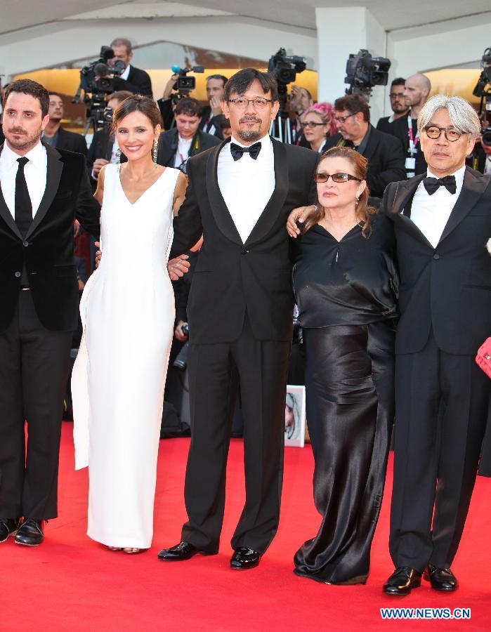 Member of the international Jury of Venezia 70 Jiang Wen (C) poses with other Jury members at the opening ceremony red carpet of the Venice Film Festival on the Lido island of Venice , Italy, Aug. 28, 2013. [Yan Ting/Xinhua]