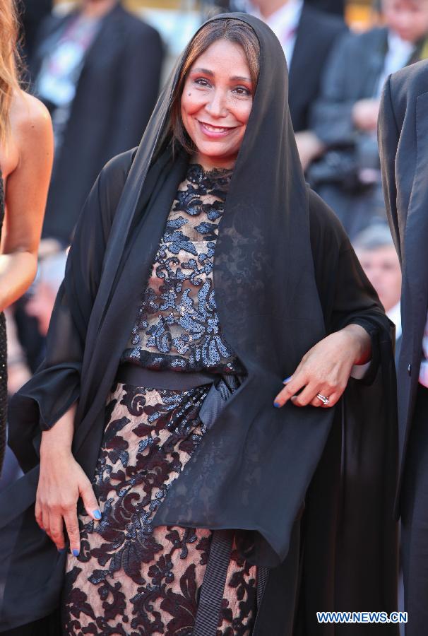 President of the international Jury of Opera Prima Haifaa Al Mansour poses at the opening ceremony red carpet of the Venice Film Festival on the Lido island of Venice , Italy, Aug. 28, 2013. [Yan Ting/Xinhua]