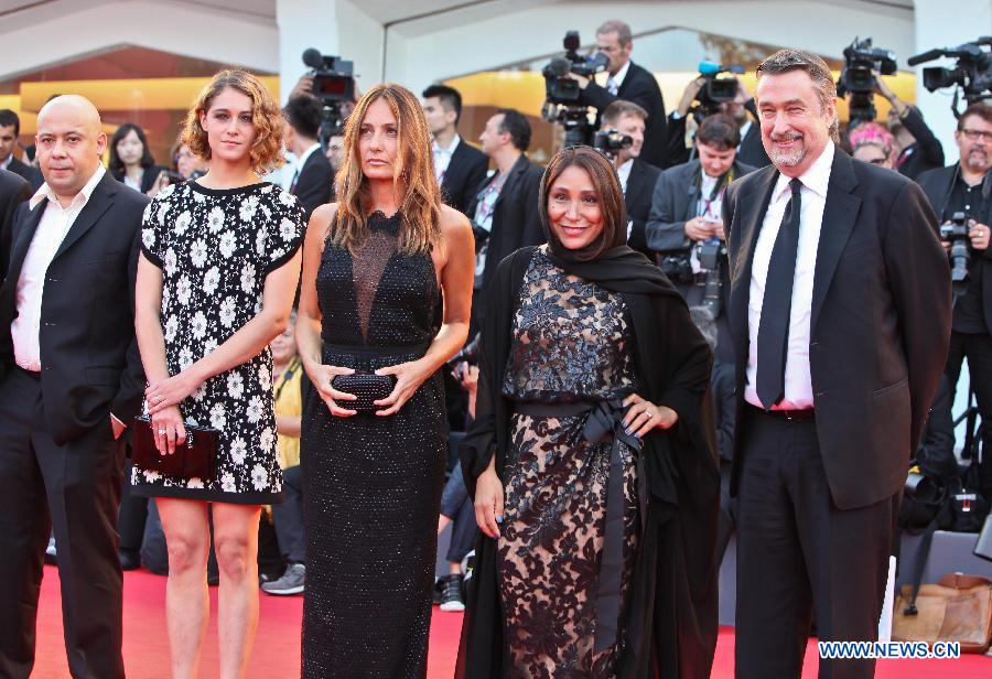 Members of the international Jury of Opera Prima pose at the opening ceremony red carpet of the Venice Film Festival on the Lido island of Venice , Italy, Aug. 28, 2013. [Yan Ting/Xinhua]