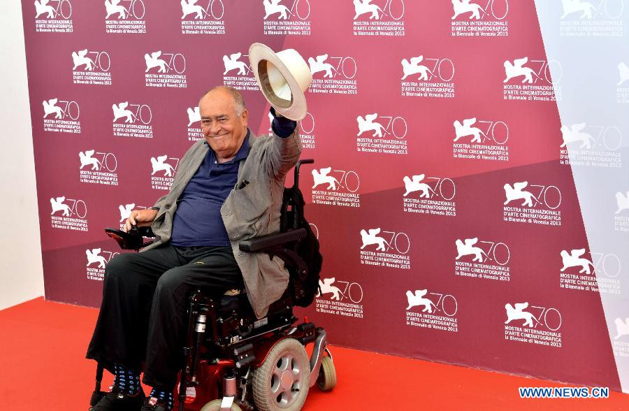 Bernardo Bertolucci, Italian director and president of the jury of Venezia 70 section, poses during a photocall at the Lido Casino, on the first day of the 70th Venice Film Festival, in Venice, Italy, on Aug. 28, 2013. [Xu Nizhi/Xinhua]