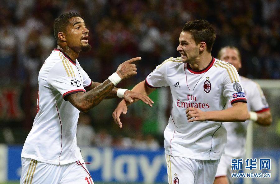 AC Milan's Prince Kevin Boateng celebrates his goal during the Champions League preliminary round football match between AC Milan and PSV Eindhoven on August 28, 2013 in San Siro Stadium. 