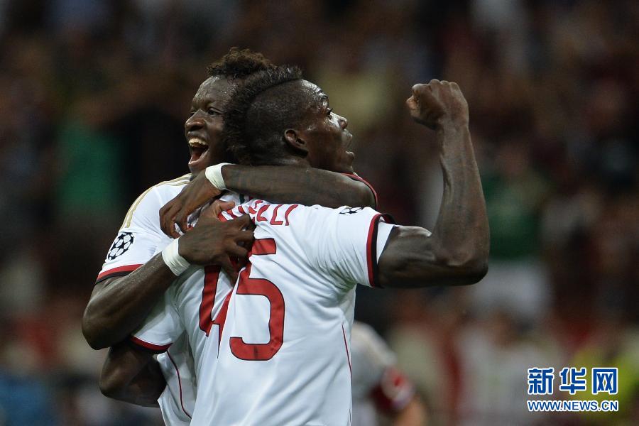 Mario Balotelli and Muntari celebrate. 