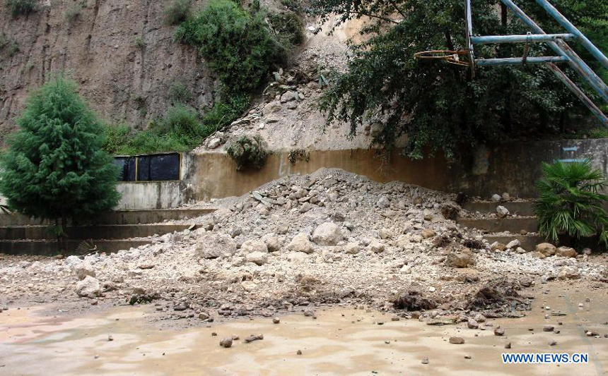 Photo taken on Aug. 31, 2013 shows the scene after an earthquake at Xingfu Village in Deqen County, southwest China&apos;s Yunnan Province. 