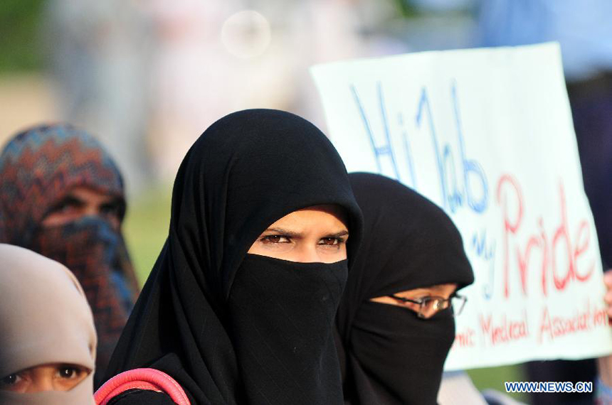 Pakistani women covering their faces with Hijab attend a rally to mark World Hijab Day in Islamabad, capital of Pakistan, Sept. 4, 2013. Nationwide rallies were organized to highlight the importance and value of hijab for Muslim women in Pakistan. [Photo/Xinhua]