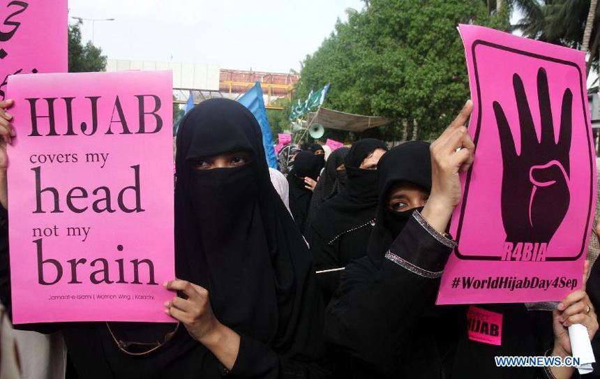 Pakistani women hold placards during a rally to mark the World Hijab Day in southern Pakistani port city of Karachi on Sept. 4, 2013. Nationwide rallies were organized to highlight the importance and value of hijab for Muslim women in Pakistan. [Photo/Xinhua]