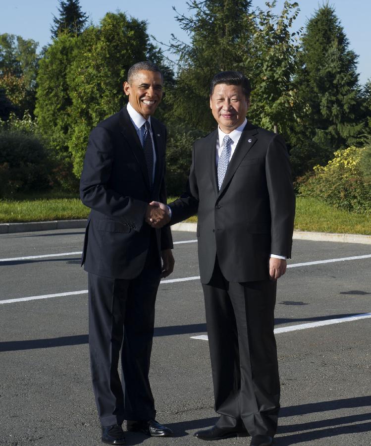Chinese President Xi Jinping (R) meets with U.S. President Barack Obama in St. Petersburg, Russia, Sept. 6, 2013. [Photo/Xinhua]