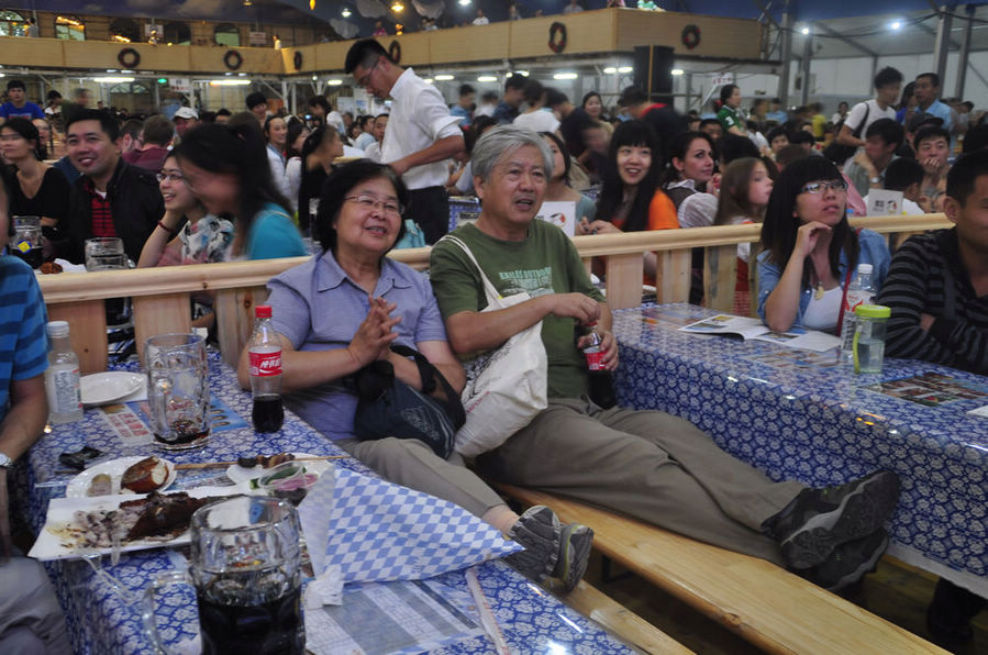 The Munich Oktoberfest started its first-ever tour of Beijing at the Beijing Olympic Park on September 6, 2013. The festival, which will run until September 21, wows beer lovers with a full range of authentic traditional beers and food from Germany.