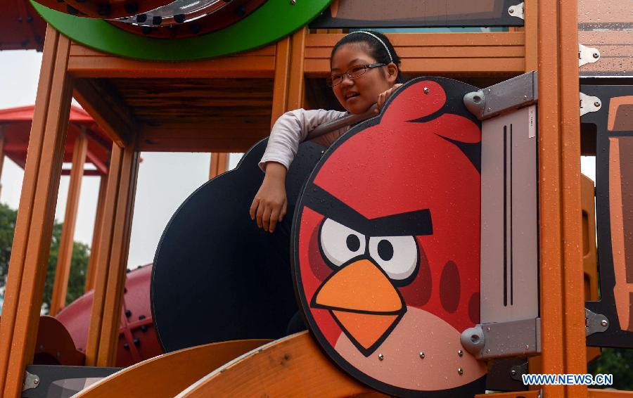 A girl plays at the newly-built Angry Birds theme park in Haining, east China's Zhejiang Province, Sept. 7, 2013. The Angry Birds theme park, the first of its kind in China, underwent a soft opening on Saturday and is expected to officially open to the public in October. Angry Birds, created by the Finland-based Rovio Entertainment, is a popular game for smartphones and tablet computers. (Xinhua/Han Chuanhao) 