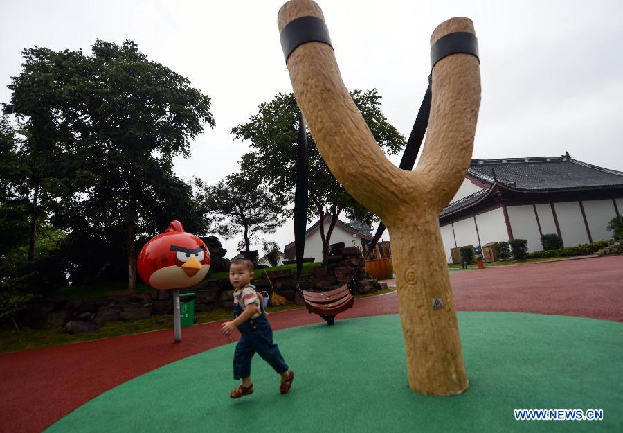 A kid plays at the newly-built Angry Birds theme park in Haining, east China's Zhejiang Province, Sept. 7, 2013. The Angry Birds theme park, the first of its kind in China, underwent a soft opening on Saturday and is expected to officially open to the public in October. Angry Birds, created by the Finland-based Rovio Entertainment, is a popular game for smartphones and tablet computers. (Xinhua/Han Chuanhao) 