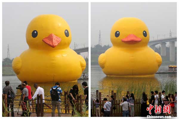 A giant rubber duck has been repaired after it was found to have a drooping beak and wrinkled skin after it made its Beijing debut on Friday.