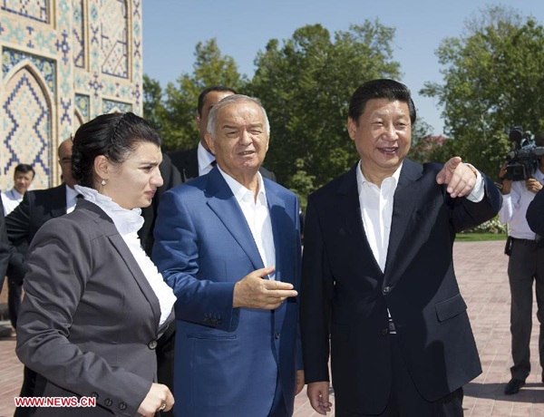 Chinese President Xi Jinping (R, front) visits the ancient Ulugh Beg Observatory with the company of Uzbekistan's President Islam Karimov (C) in Samarkand, Uzbekistan, Sept. 10, 2013. (Xinhua/