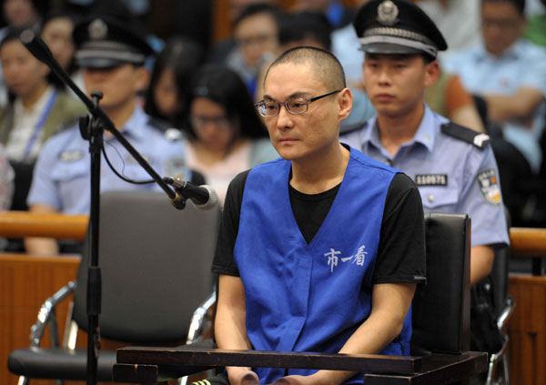 Han Lei, who was charged with the murder of a 2-year-old girl after a dispute with the child's mother over car parking on July 23, stands trial Monday morning at the Beijing No 1 Intermediate People's Court. [Photo/Xinhua]