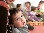 Syrian children return to crowded schools in tact