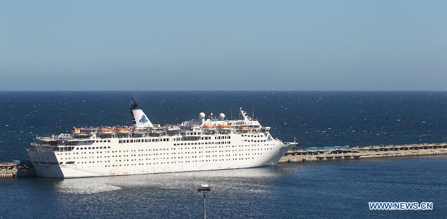 The detained Chinese cruise liner Henna is seen in Jeju, South Korea, Sept. 16, 2013. The detained Chinese cruise liner Henna departed from South Korea&apos;s Jeju Island for China at 8:30 p.m. local time on Monday with the rest of more than 50 passengers on board, according to the Chinese Consulate General in Jeju Island. 