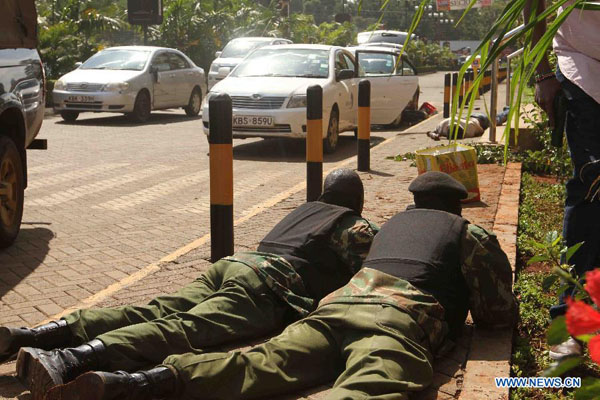 The hostage standoff between gunmen and Kenyan security forces has continued into Sunday, about 20 hours after the shooting rampage broke out at an upscale shopping mall in Nairobi, killing at least 39 people. [Xinhua Photo]