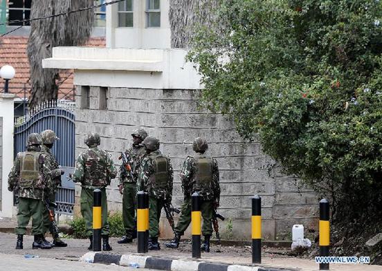 Kenyan soldiers patrol near the Westgate shopping center in Nairobi, Sept. 24, 2013. Kenyan security forces continued its operation on Tuesday inside the mall where 62 people were killed by gunmen since Saturday, after more gunmen were killed as the siege of the mall enters the fourth day. [Zhang Chen/Xinhua] 