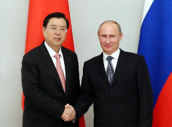 Zhang Dejiang (L), chairman of the Standing Committee of China's National People's Congress, meets with Russian President Vladimir Putin in Sochi, Russia, Sept. 23, 2013. [Yao Dawei/Xinhua]